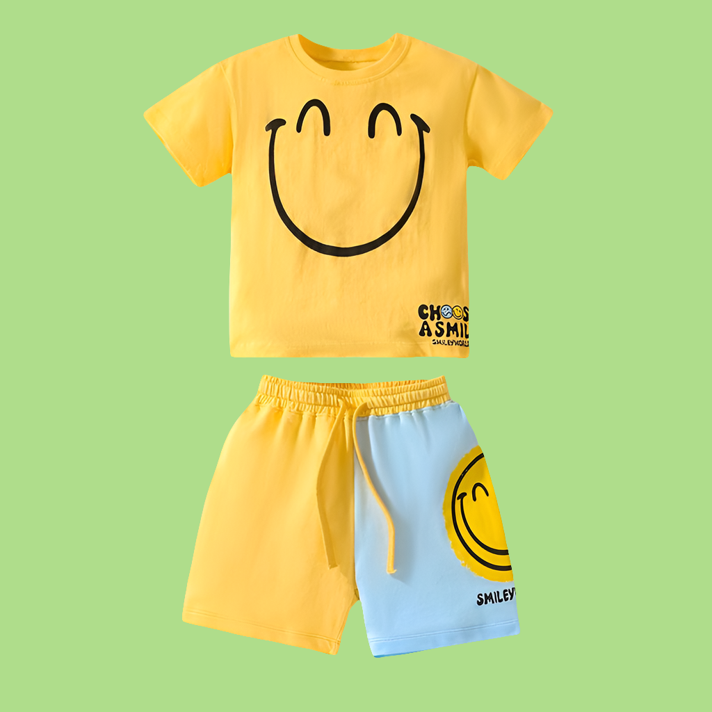 Yellow t-shirt and blue shorts with smiley face design on a green background