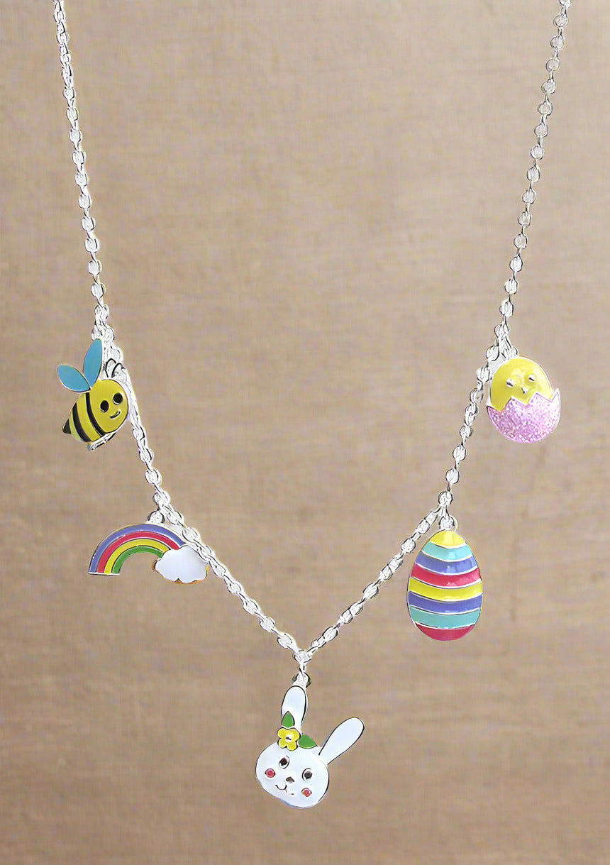 A colorful Easter theme necklace with multiple charms including a bee, a rainbow, an egg, and a rabbit.