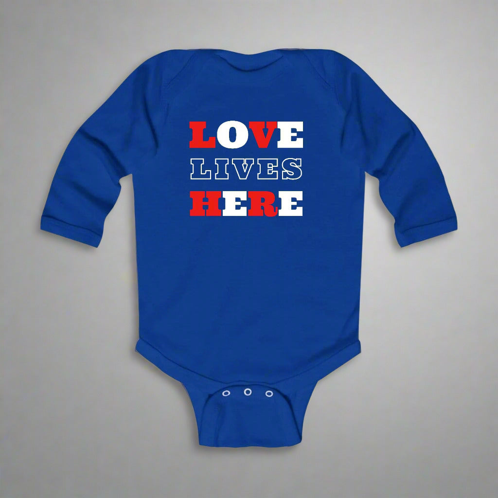 A blue long-sleeve infant bodysuit with the text 'LOVE LIVES HERE' printed in red and white.