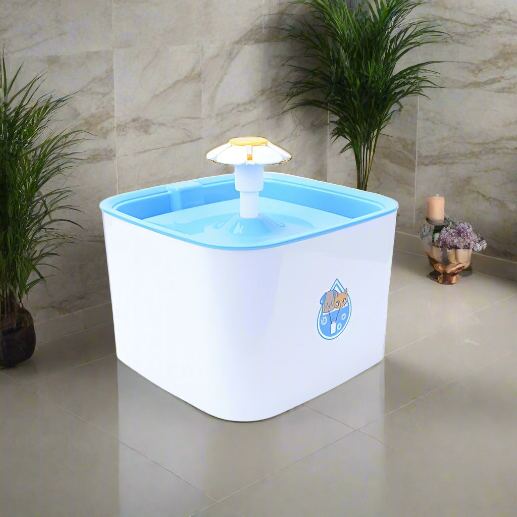 A white pet fountain with a blue water tray and a yellow spout, designed to dispense water for pets.