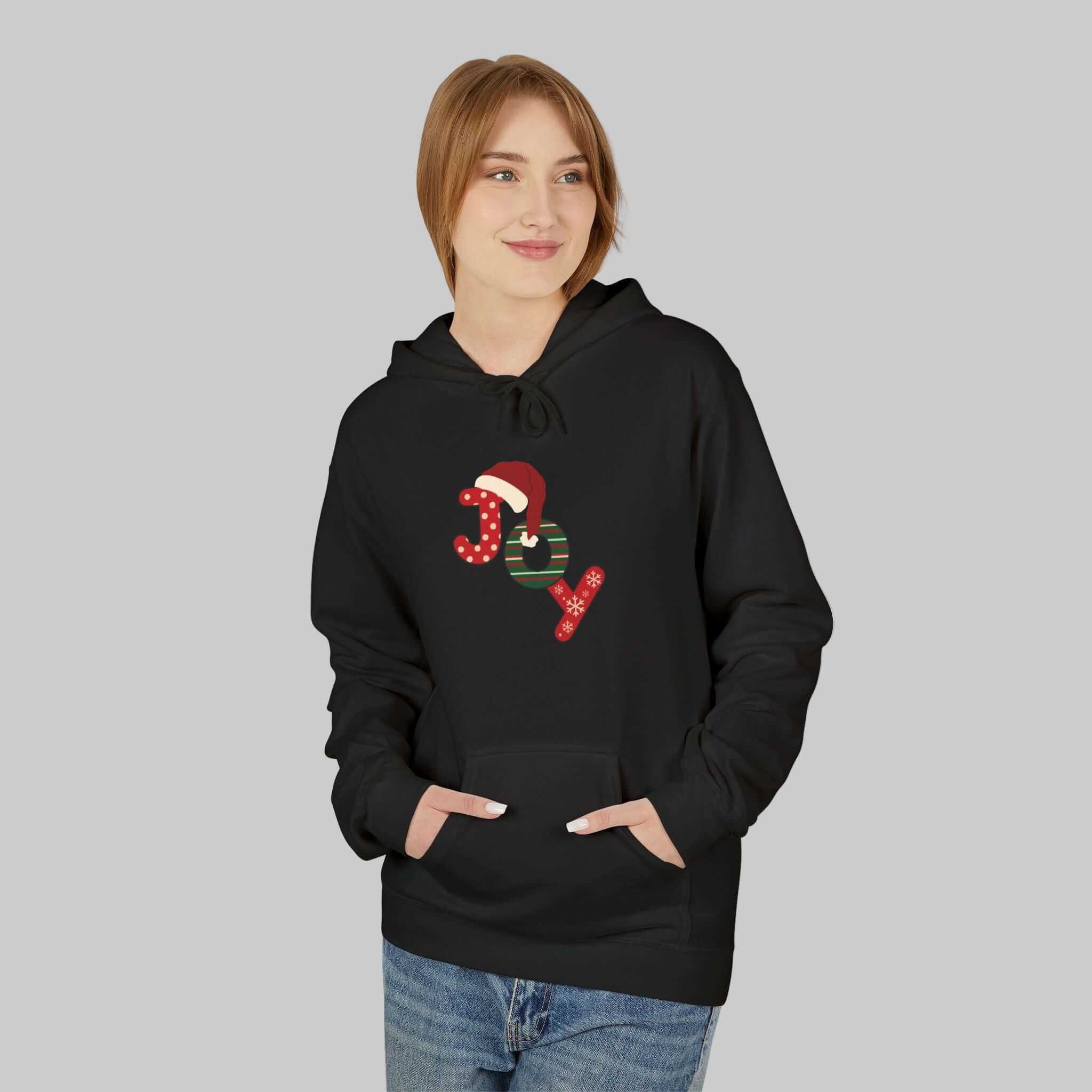 Person wearing a black hoodie with Christmas-themed design on a white background