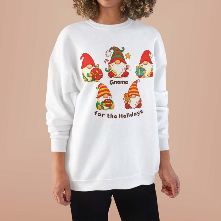 Woman wearing a white sweatshirt with Christmas gnome graphics on a beige background
