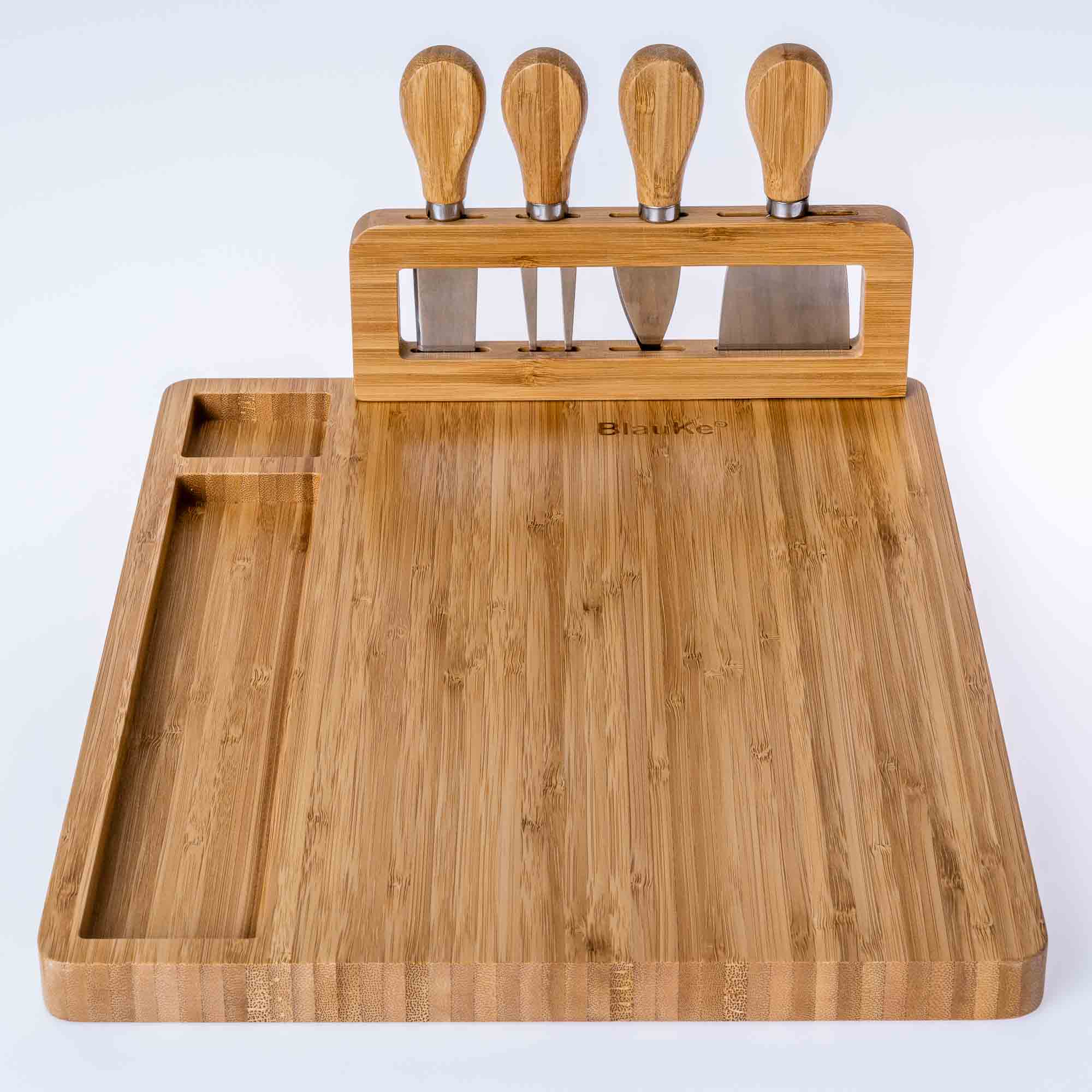 Wooden cutting board with knife holder on a white background