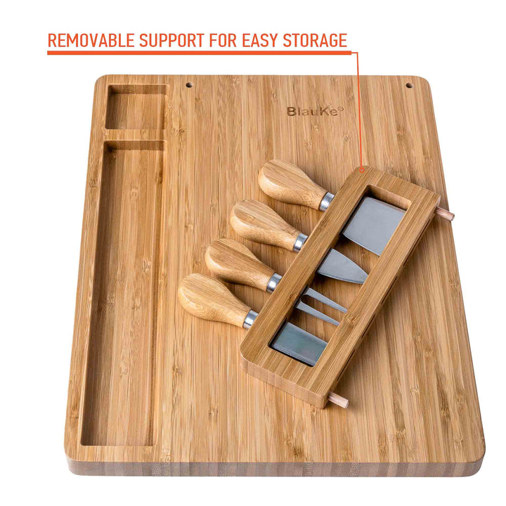Wooden cutting board with cheese knives and a removable support for easy storage.