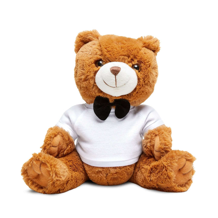 Brown teddy bear wearing a white shirt with text and a black bow tie on a white background