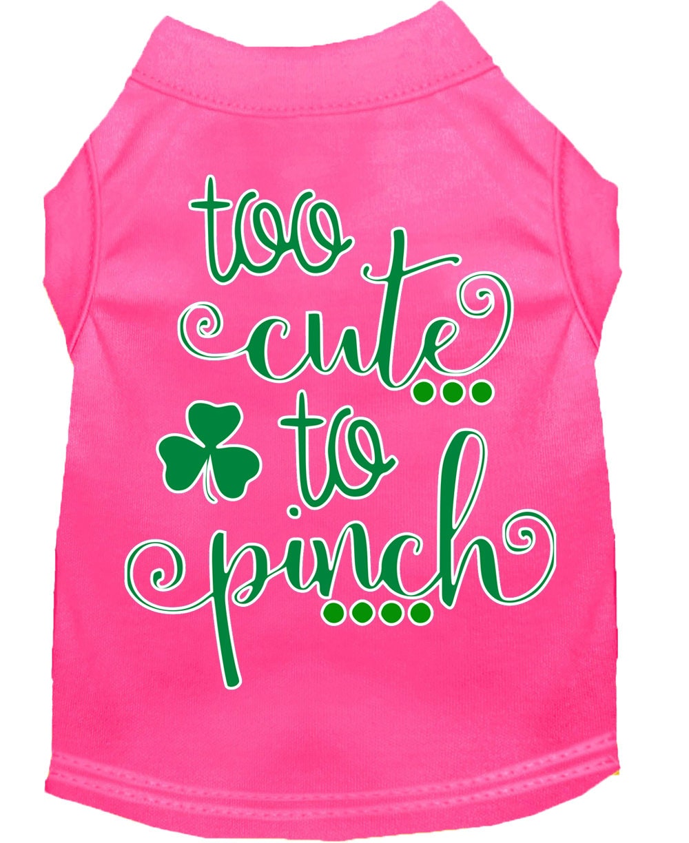 Pink dog shirt with green text and shamrock on a white background