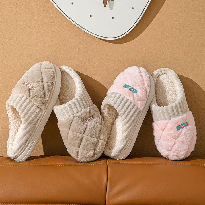 Cozy non-slip house slippers in cream and pink displayed on leather seat”