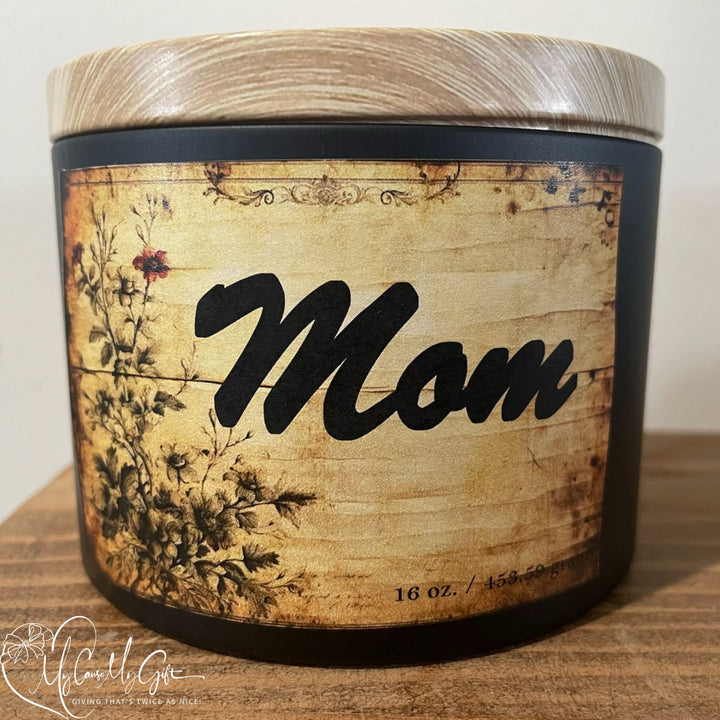 Custom “Mom” 16 oz soy candle in black jar with wooden lid, featuring rustic vintage floral label design, handcrafted decorative candle perfect for Mother’s Day, birthdays, or thoughtful gifts for moms.