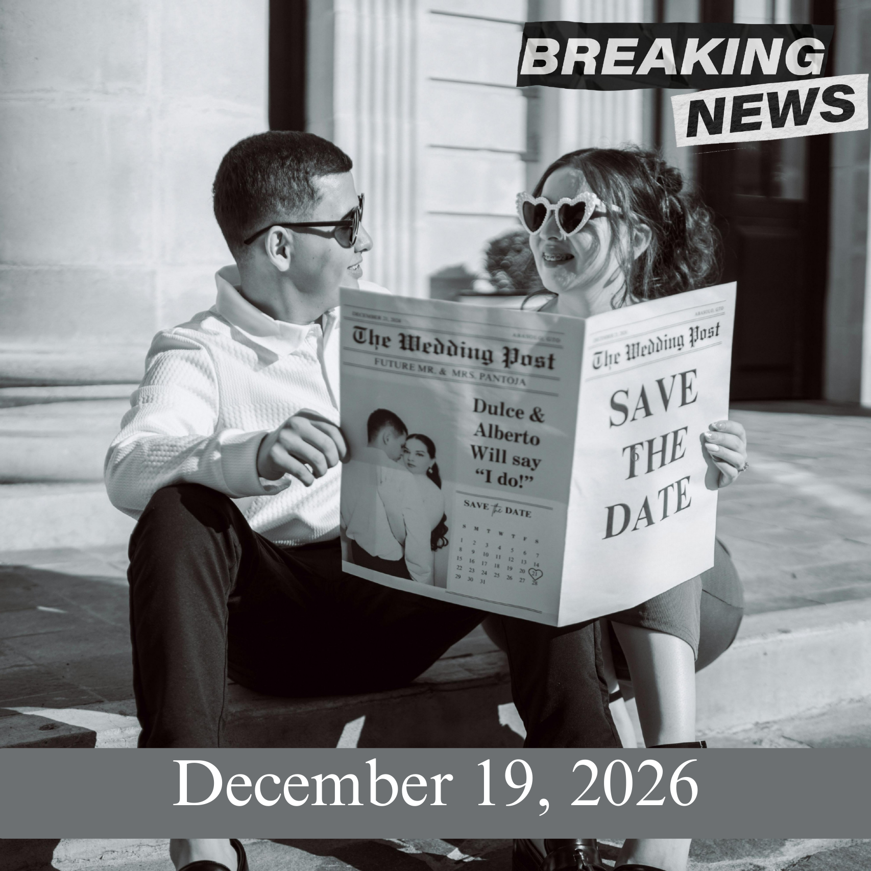 Black and white image of a couple reading a newspaper with 'Save the Date' text, sitting on steps.