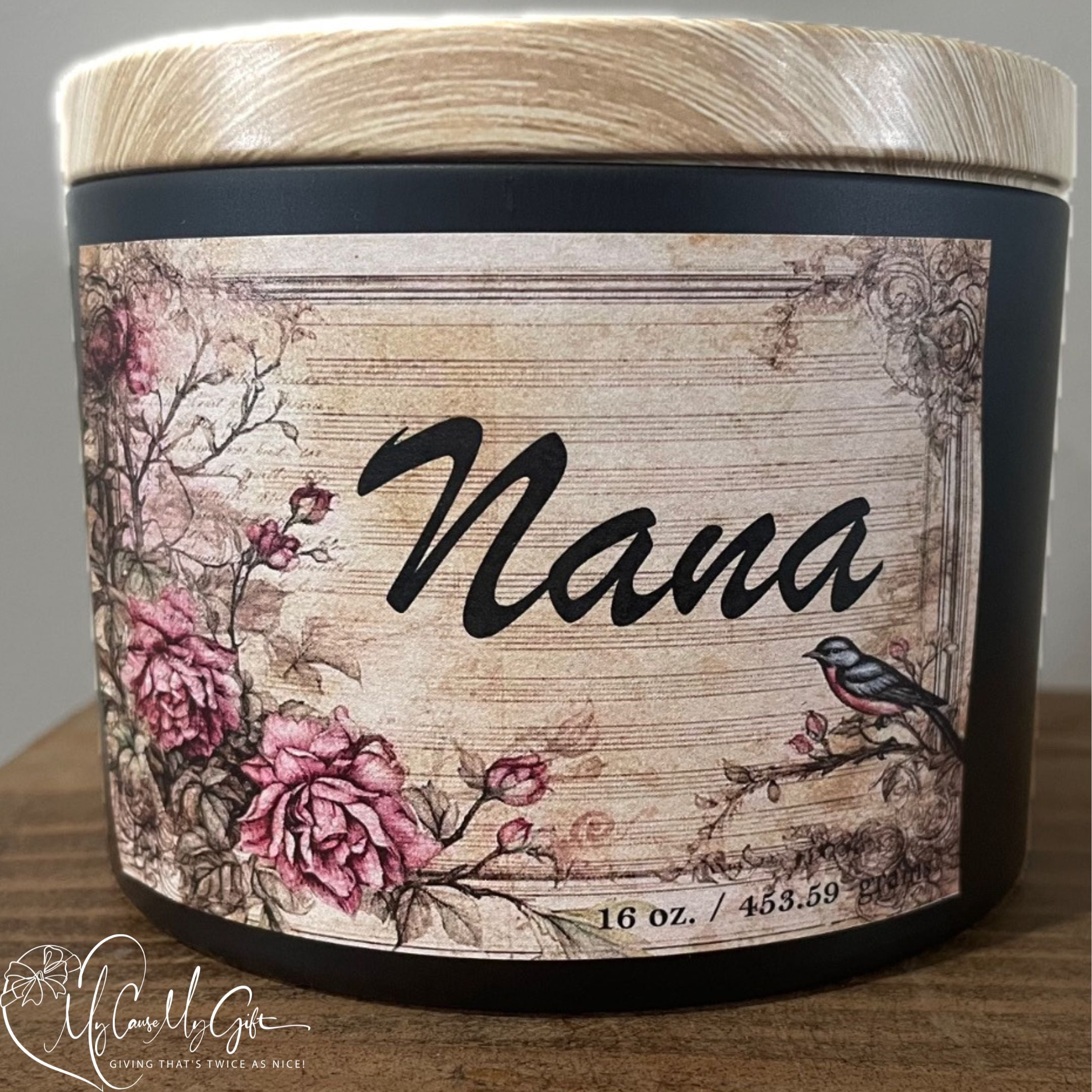 Custom “Nana” 16 oz soy candle in black jar with wooden lid, featuring rustic vintage floral label design, handcrafted decorative candle perfect for Mother’s Day, birthdays, or thoughtful gifts for garndmothers.
