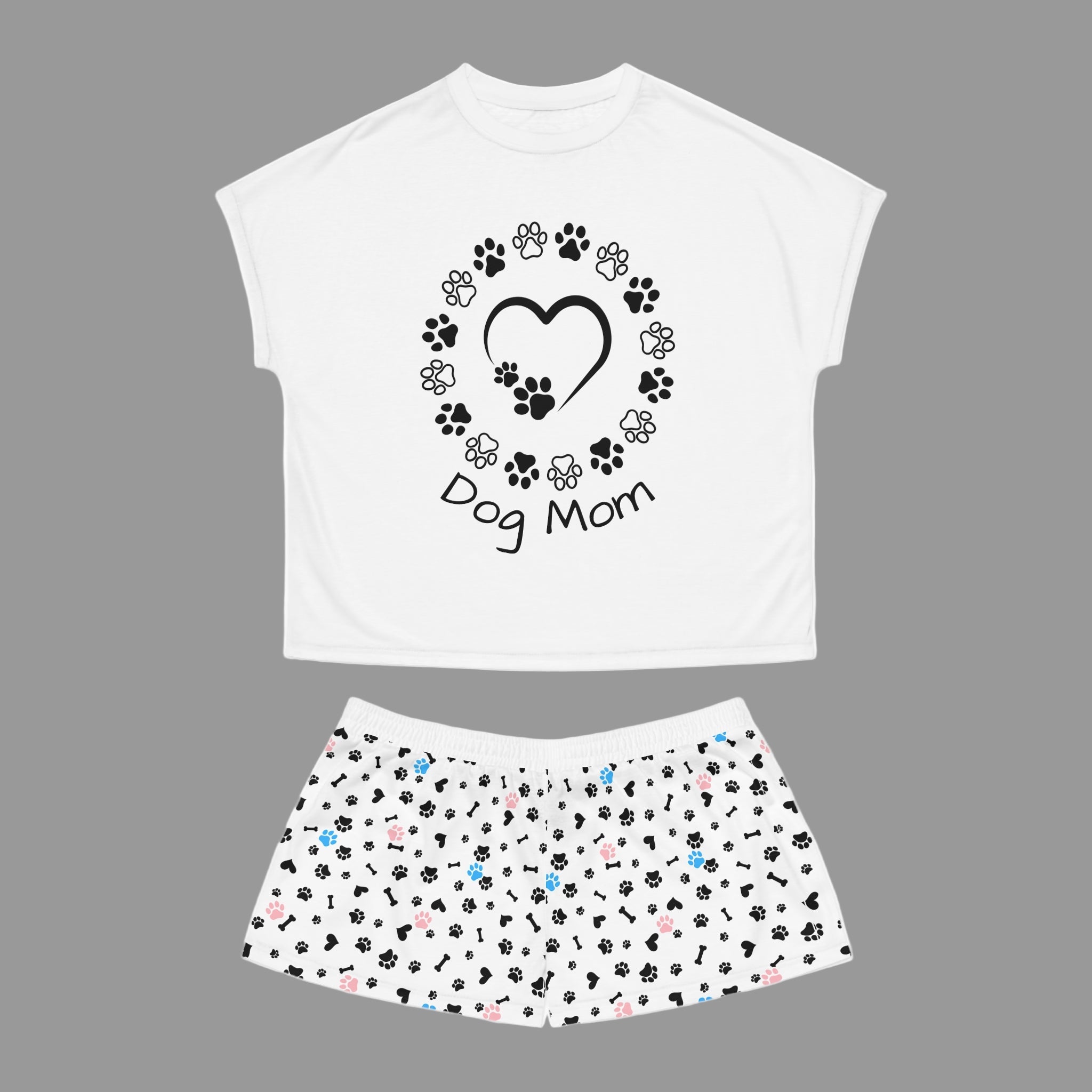 White t-shirt with 'Dog Mom' design and matching skirt with paw print pattern on a white background