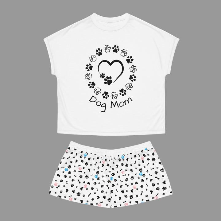 White t-shirt with 'Dog Mom' design and matching skirt with paw print pattern on a white background