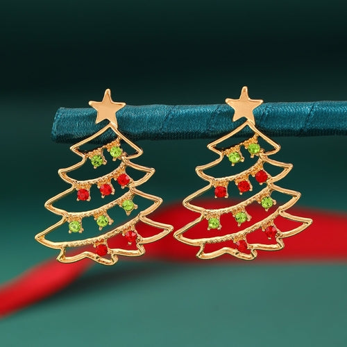Festive Christmas tree earrings with star tops on holiday background