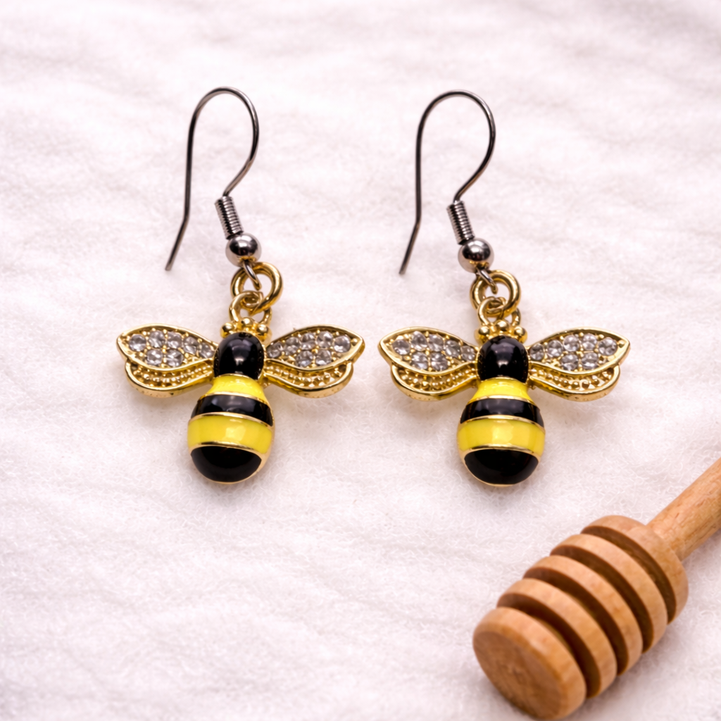 Gold and silver winged bee dangle earrings with sparkling wings, lightweight hypoallergenic jewelry by Sonya Lee.