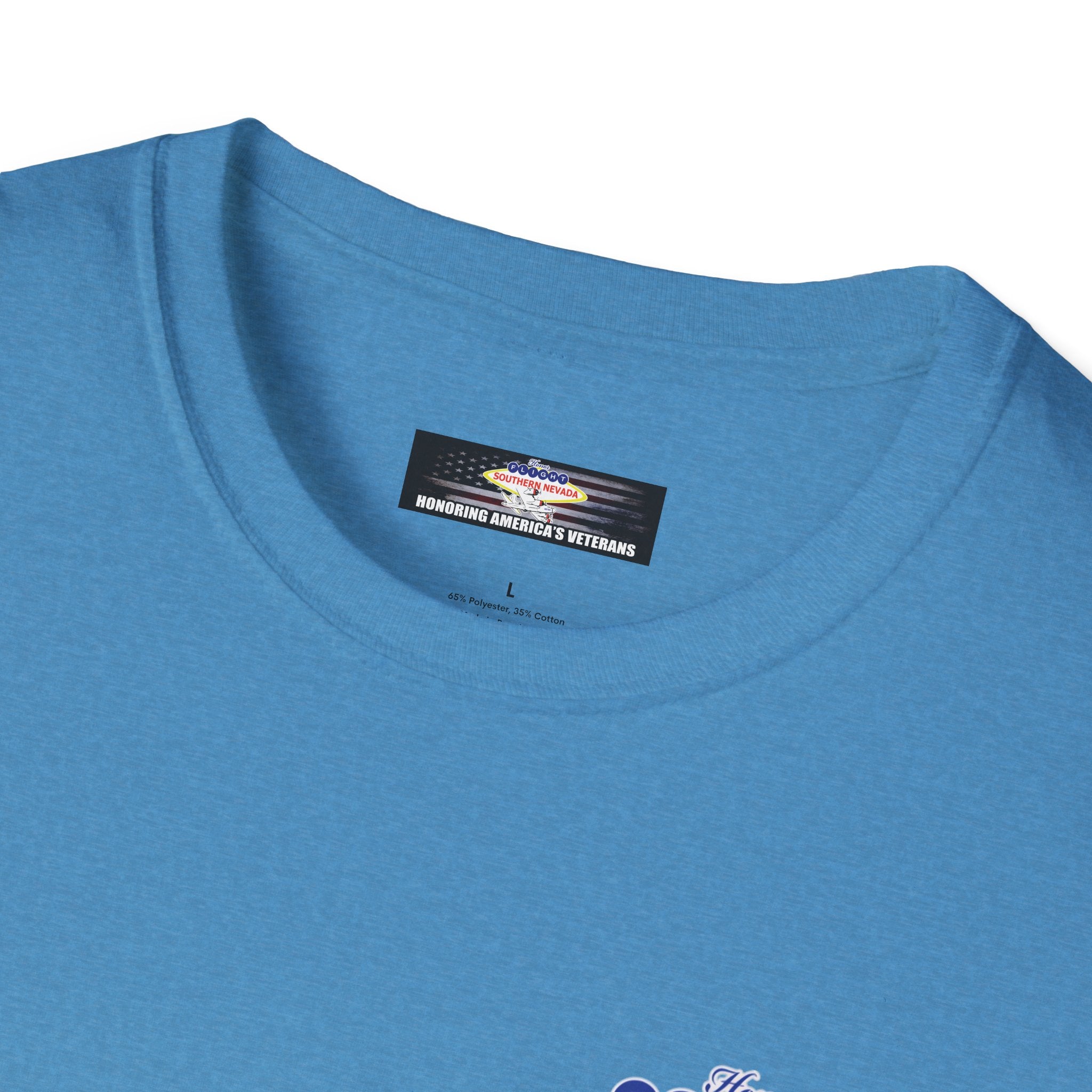 Close-up of a blue t-shirt with a label on a white background