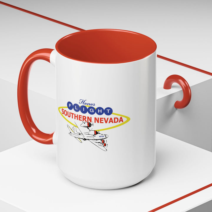 Honor Flight Southern Nevada 11oz ceramic accent coffee mug with red handle and patriotic logo on kitchen counter 15oz
