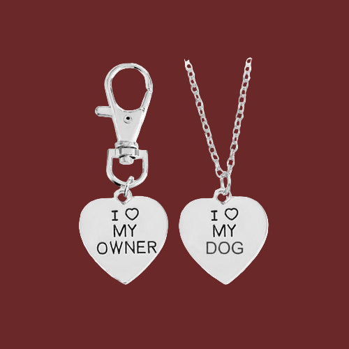 Silver “Love My Dog and Love My Owner matching heart necklaces displayed on red background