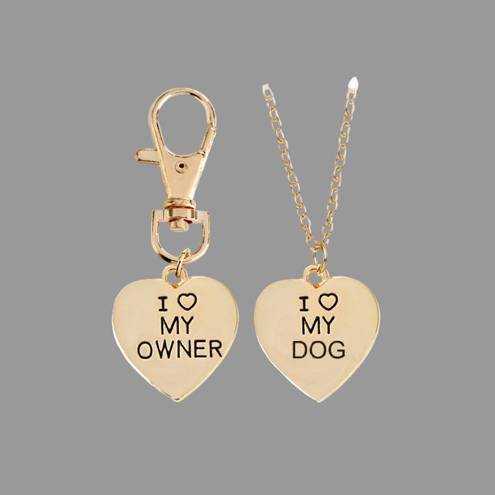 Gold heart-shaped pendants with 'I ❤️ MY OWNER' and 'I ❤️ MY DOG' text on a white background.