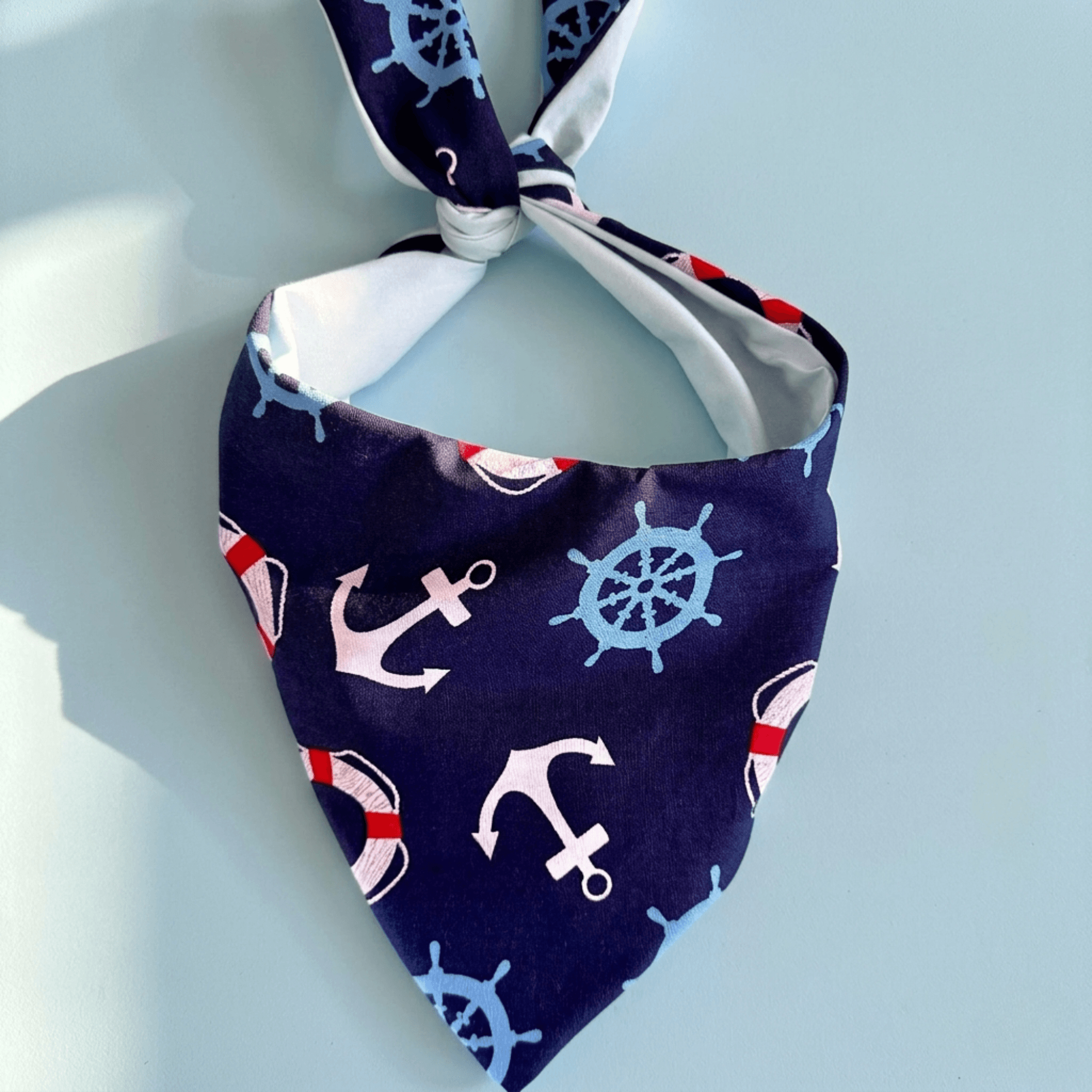 Nautical dog bandana summer featuring a delightful sailboat and anchor design for stylish beach outings.