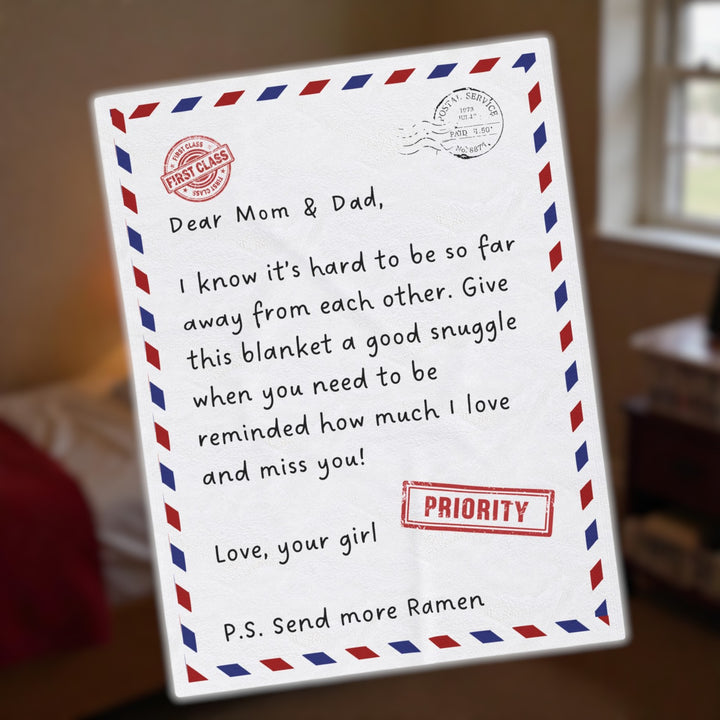 Personalized blanket designed like an airmail letter with a heartfelt message from daughter to parents
