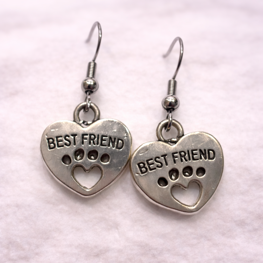 Pet lover dangle earrings with heart and paw print design reading “Best Friend,” hypoallergenic and lead-free, from the Jewelry by Sonya Lee collection.