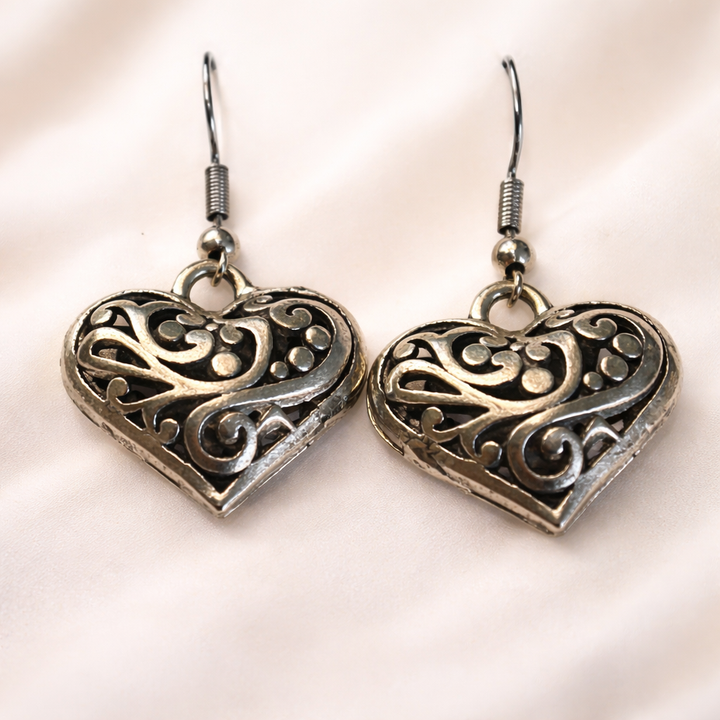 Puffy heart filigree earrings by Sonya Lee with an intricate, dimensional design. Hypoallergenic, lead-free, and every purchase gives back.