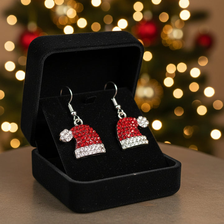 Red Santa hat earrings with clear stones in a jewelry box