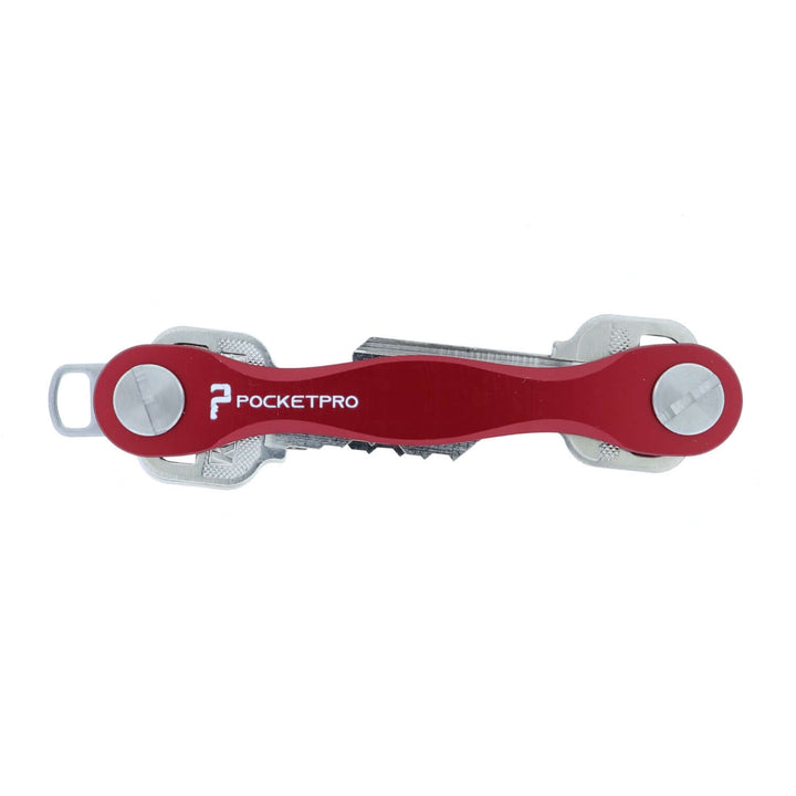 Red PocketPro Edge slim aluminum key organizer holding multiple keys in compact quiet pocket-friendly design