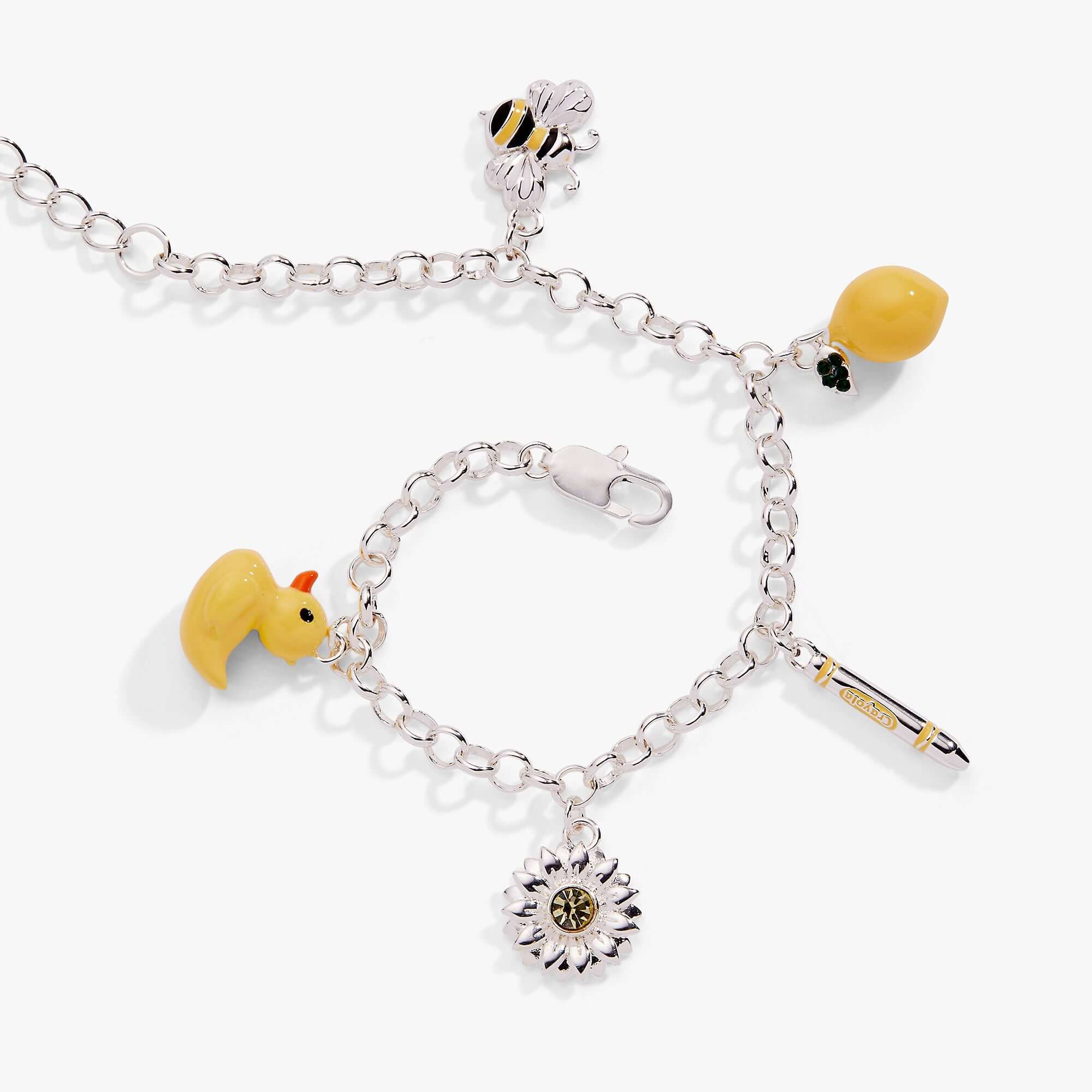Silver bracelet with various charms including a bee, duck, and sunflower on a white background