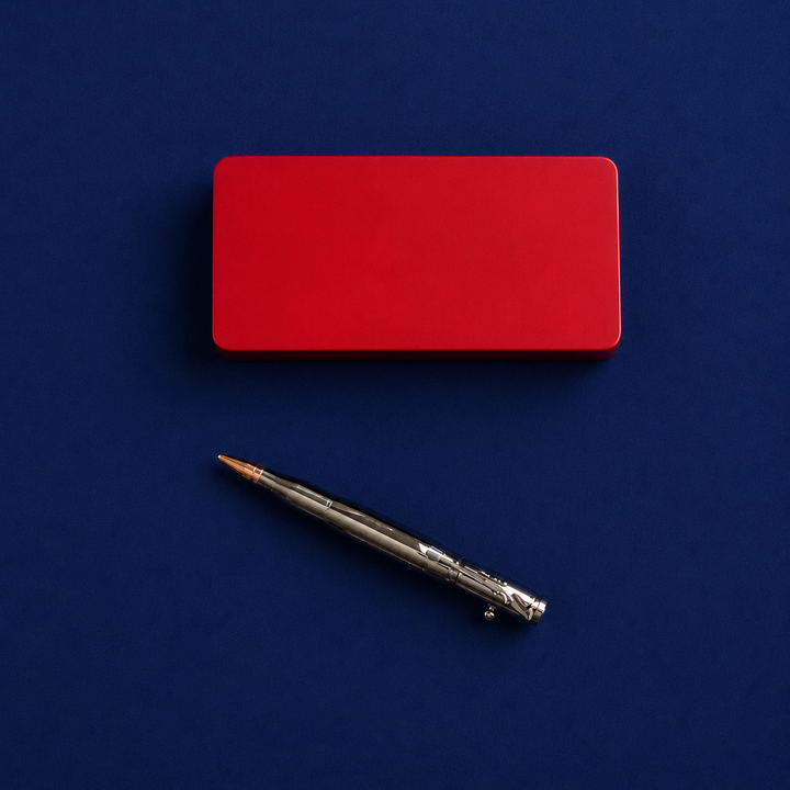 Red gift box and pen on a blue background