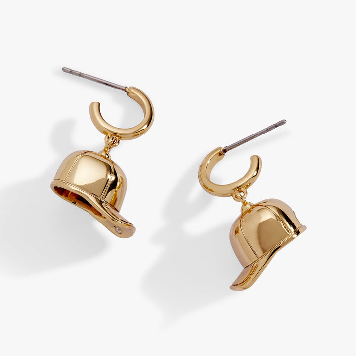 Baseball Cap Huggie Drop Earrings featuring gold-plated huggie hoops and baseball cap charms.