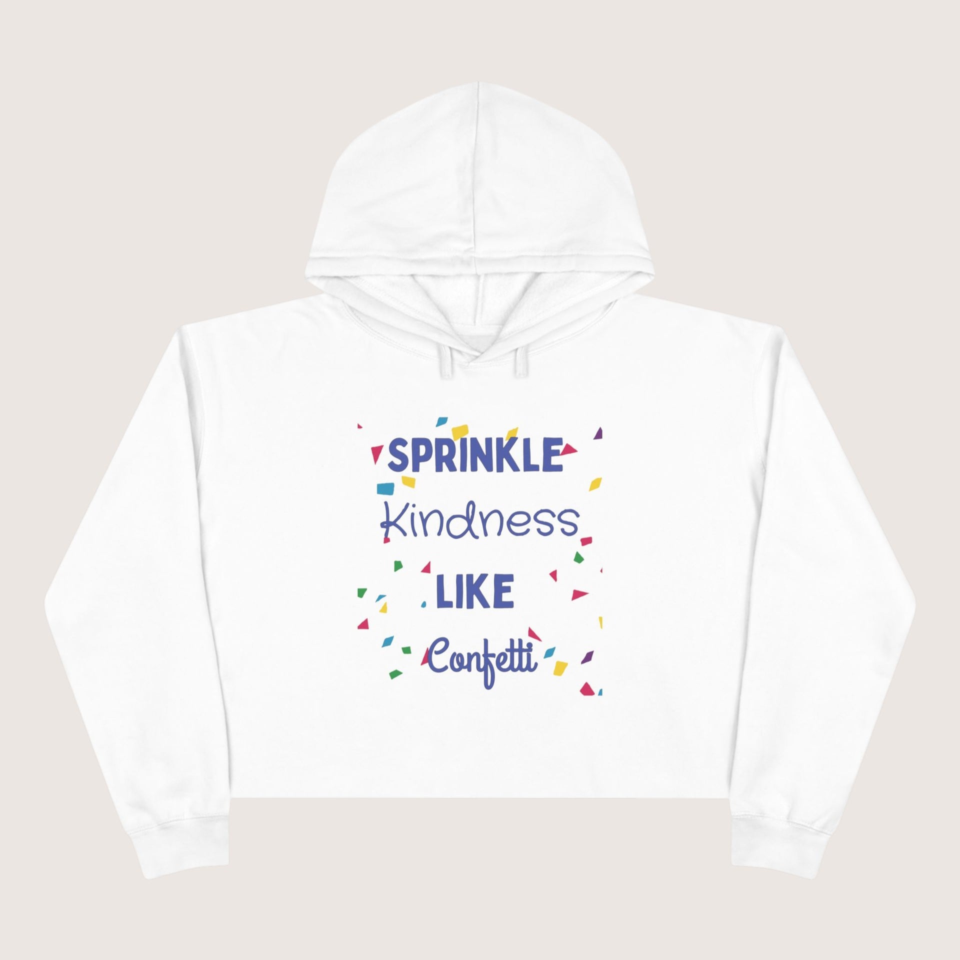 White hoodie with colorful text 'Sprinkle Kindness Like Confetti' on a beige background