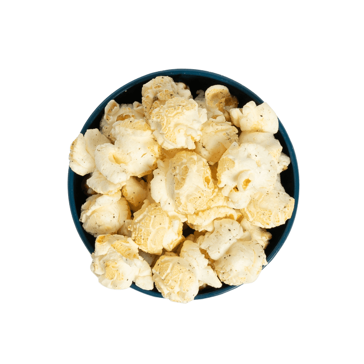 Bowl of Stevie G’s Gourmet Pepper Popcorn with fluffy yellow kernels in teal bowl viewed from above
