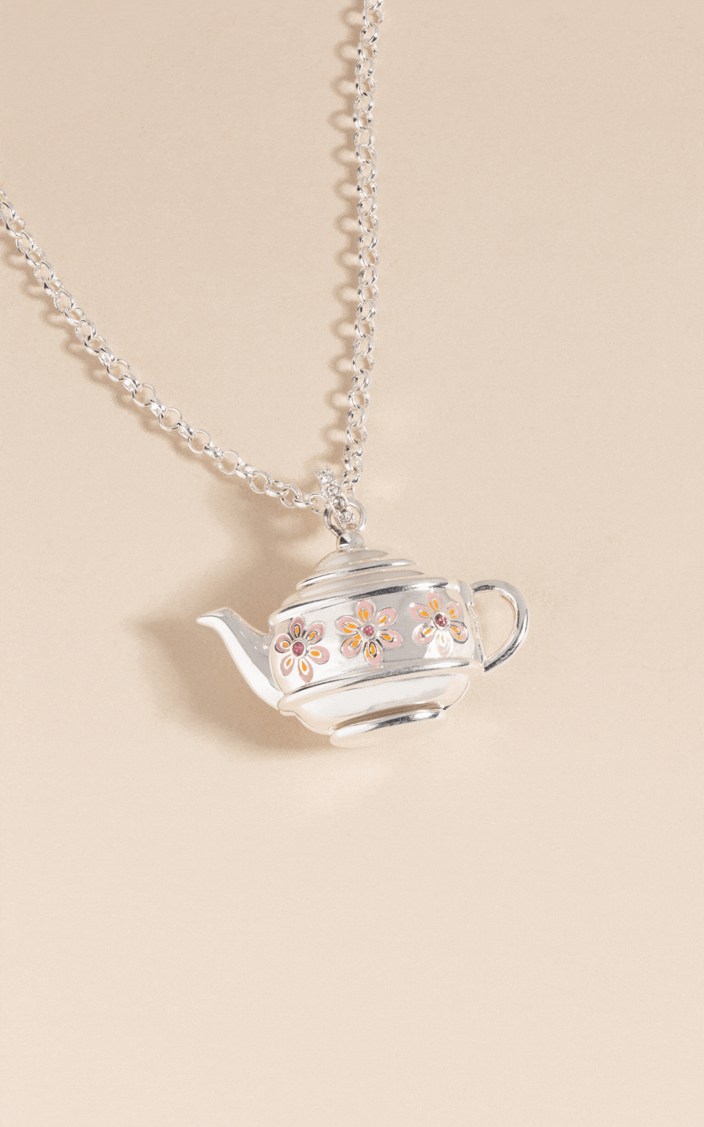 Teapot locket necklace worn on chain