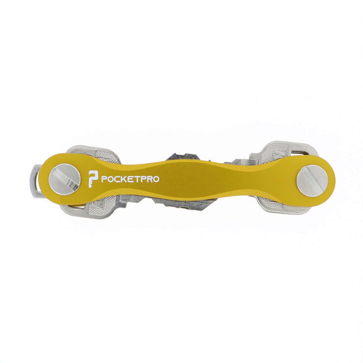 Yellow PocketPro Edge slim aluminum key organizer holding multiple keys in compact quiet pocket-friendly design