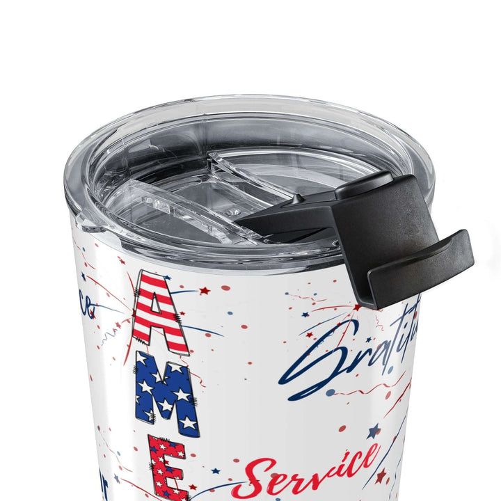 Close-up view of America 250 patriotic travel mug showing retro graphics and a spill-proof lid.