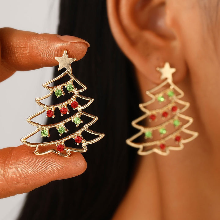 Woman wearing gold Christmas tree earrings with red and green accents