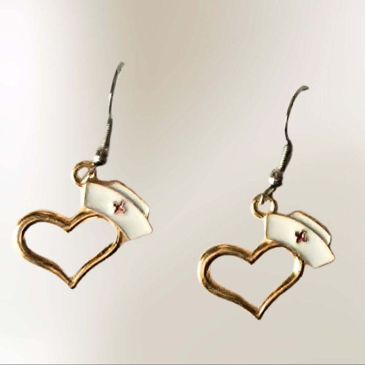 Gold heart nurse hat earrings with white nurse cap accents and hook backs by Jewelry by Sonya Lee