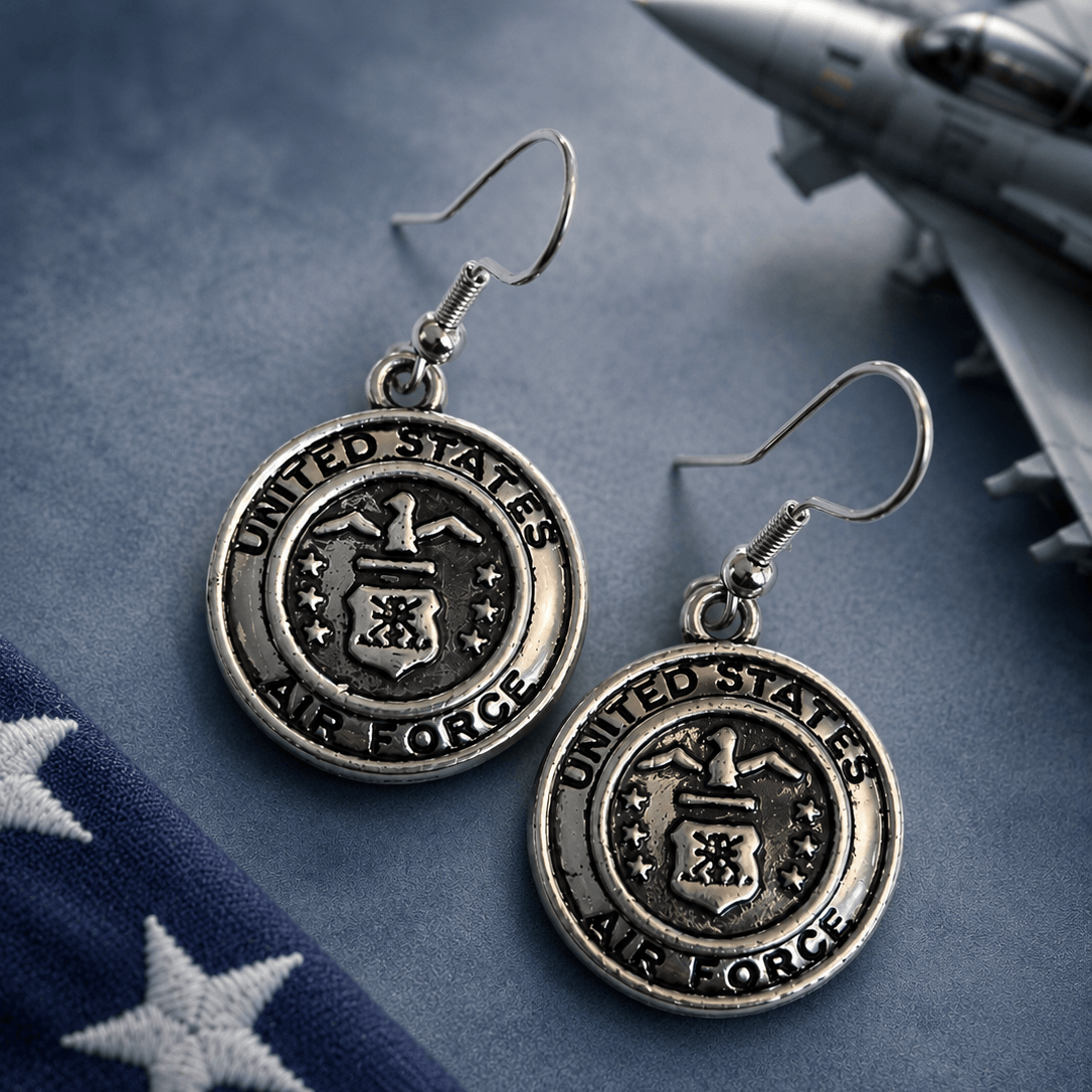 Vintage style United States Air Force patriotic dangle earrings with silver medallion design beside American flag and aircraft background