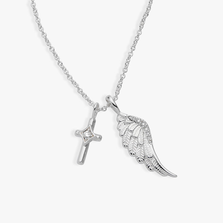 Silver necklace with a cross and feather pendant on a white background