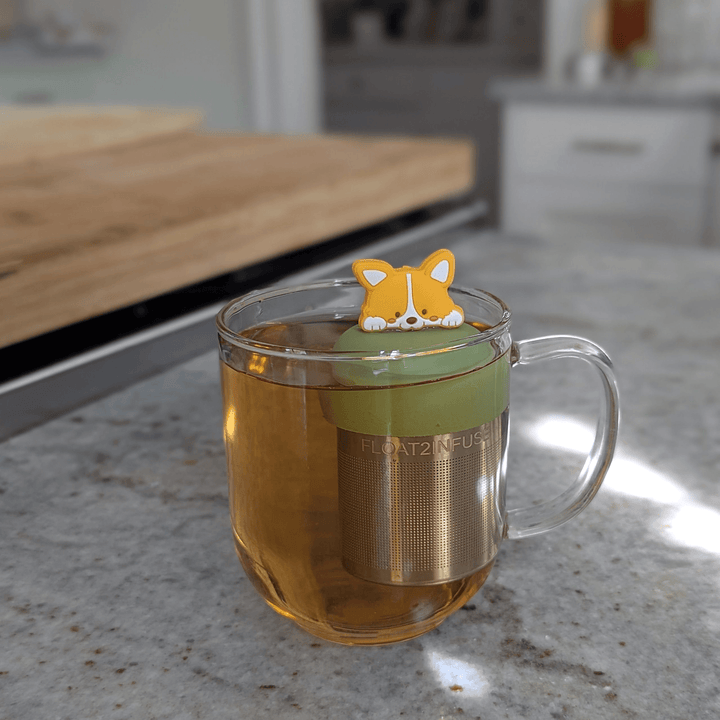 floating corgi tea infuser steeping loose leaf tea in mug