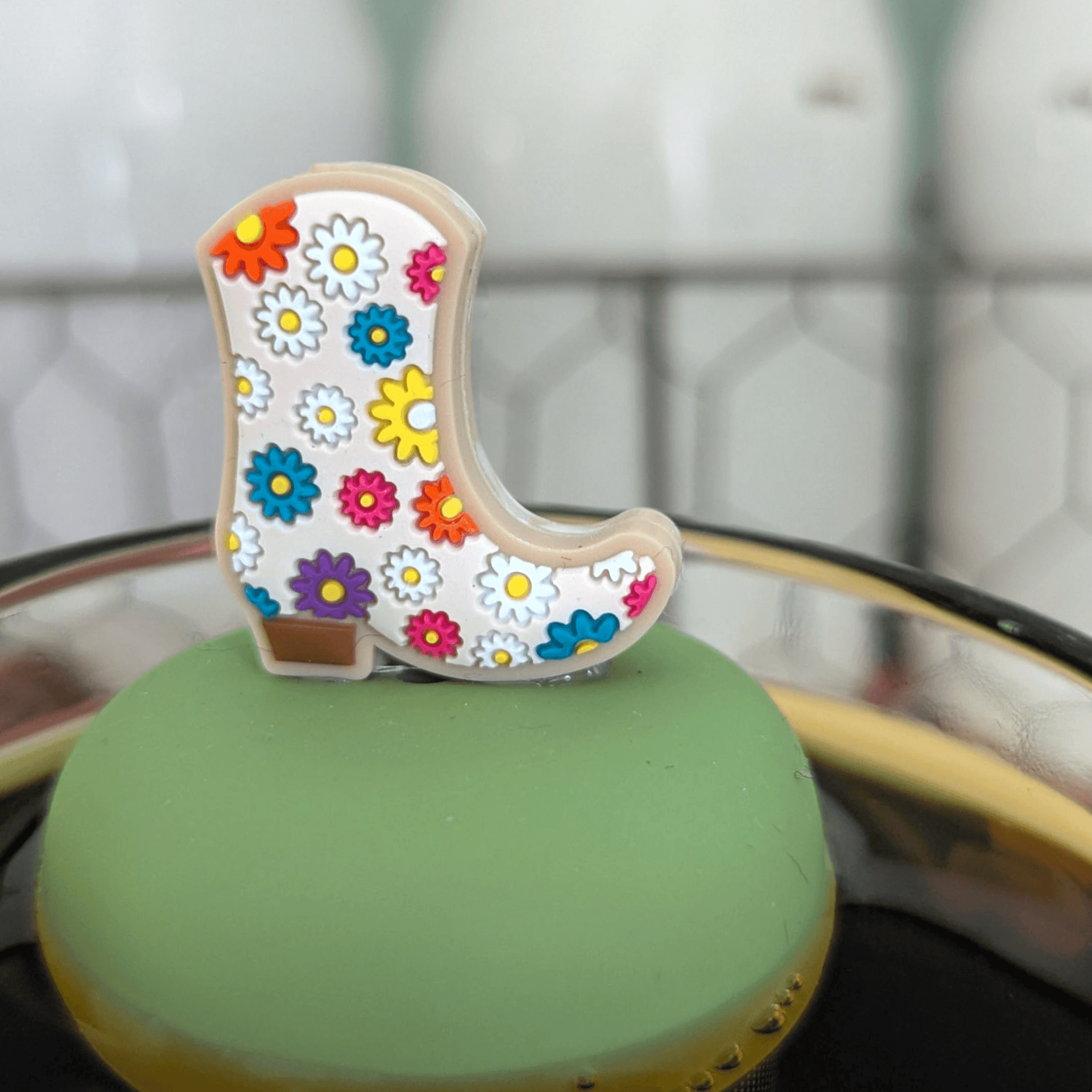 floating cowboy boot tea infuser steeping loose leaf tea in mug