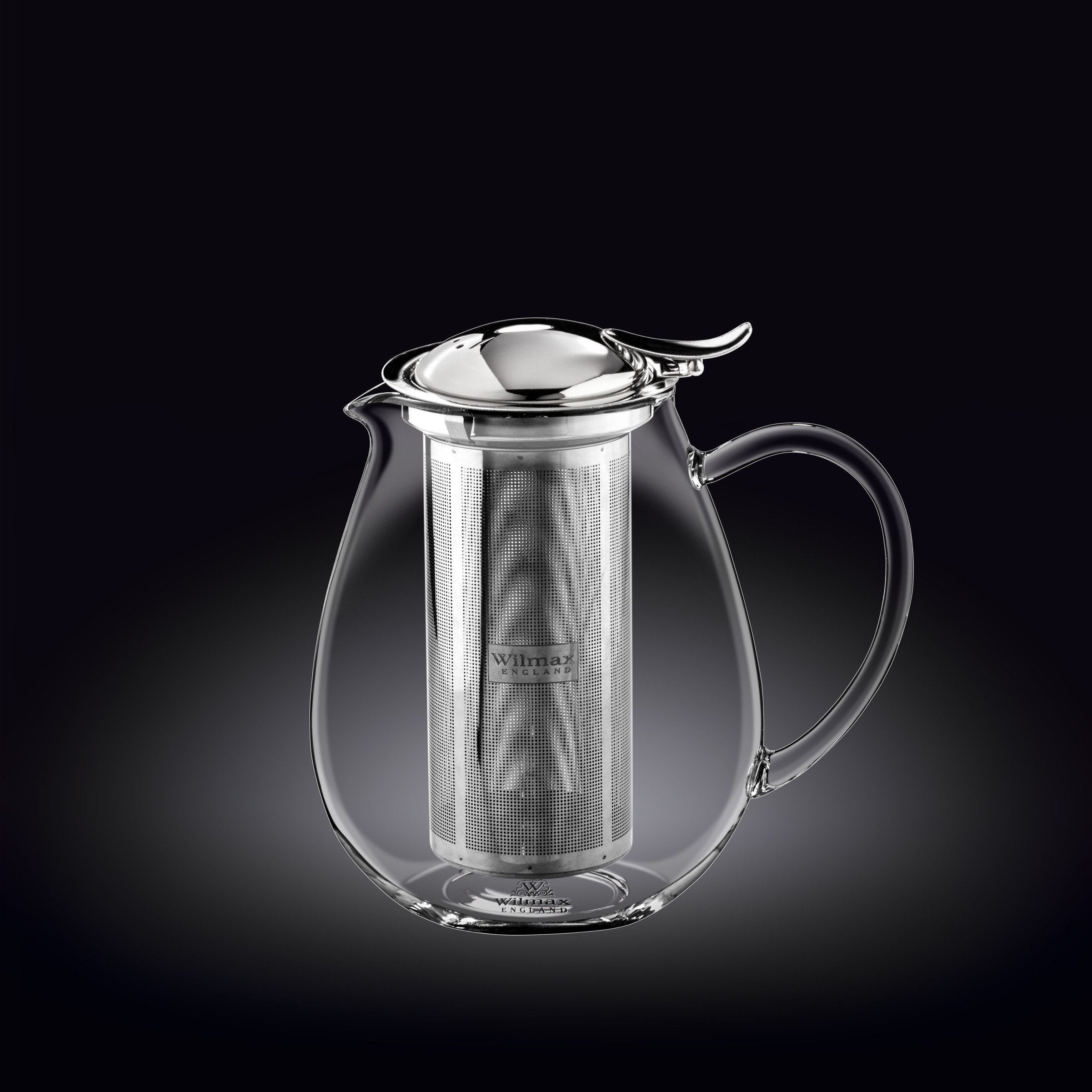 Clear glass teapot with metal infuser on a black background