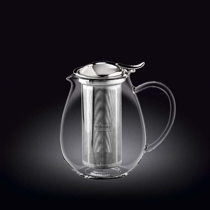 Clear glass teapot with metal infuser on a black background