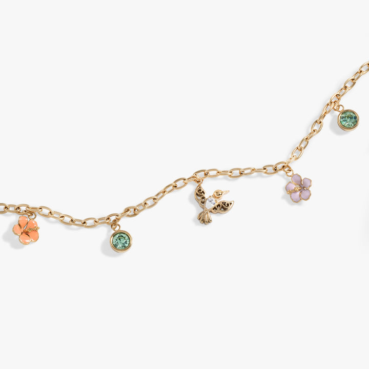 Hummingbird multicharm adjustable anklet featuring hibiscus and chrysolite charms, ideal for stylish accessorizing.