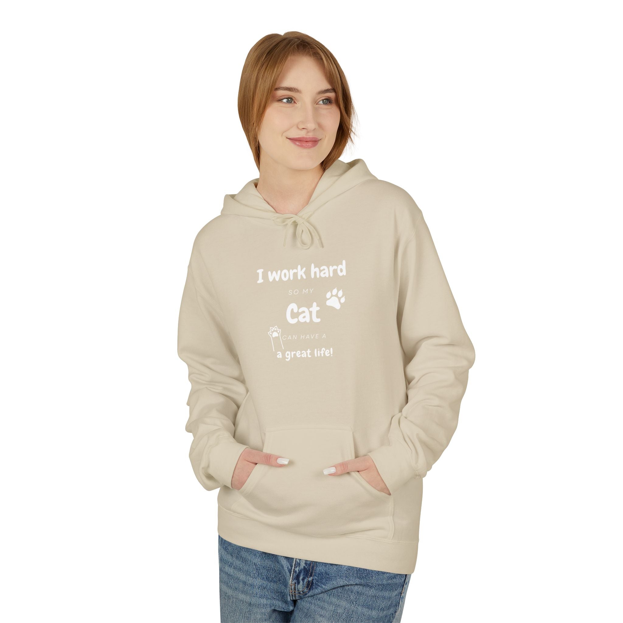 Woman wearing beige hoodie with text “I work hard so my cat can have a great life,” featuring cat paw print — cozy cat lover gift sweatshirt.