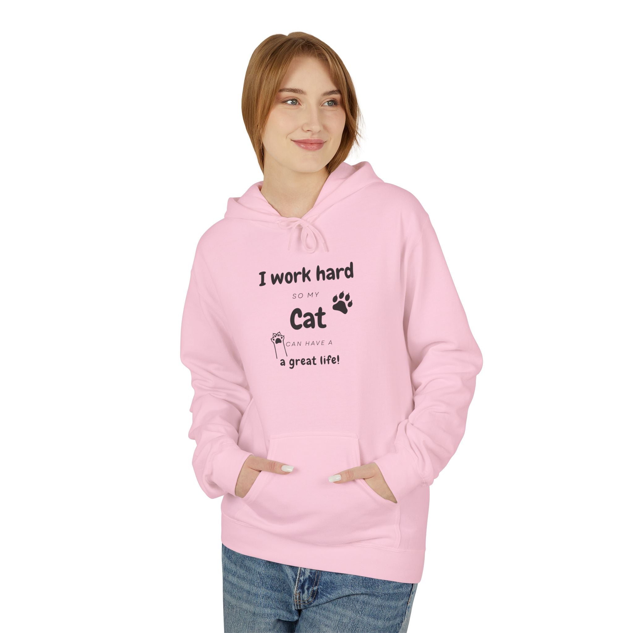 Woman wearing pink hoodie with text “I work hard so my cat can have a great life,” featuring cat paw print — cozy cat lover gift sweatshirt.
