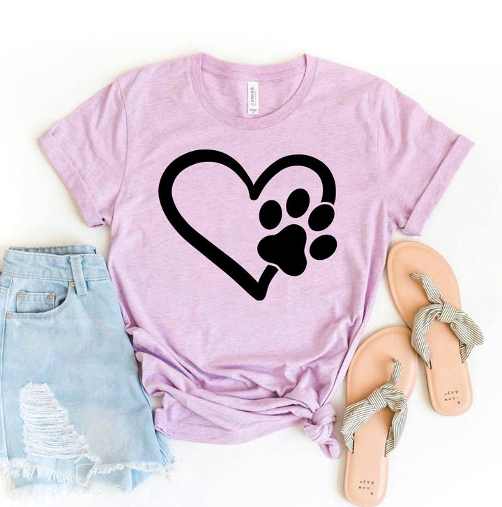 Pink Bella Canvas Paw Heart T-Shirt featuring a black paw print heart graphic for dog lovers, pet parents, and animal enthusiasts.