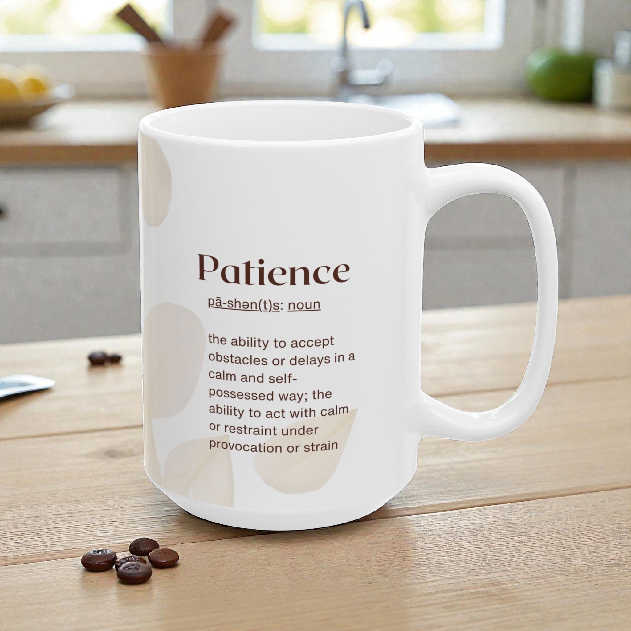 White mug with 'Patience' definition on a kitchen counter