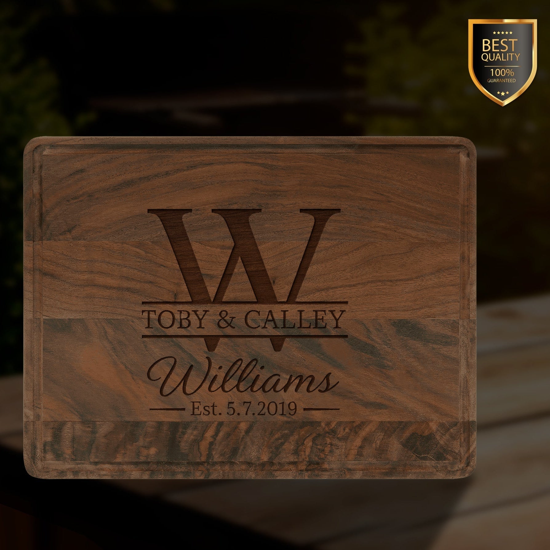 Personalized walnut cutting board with engraved family name and monogram, featuring a drip ring for food preparation, serving, and charcuterie displays.